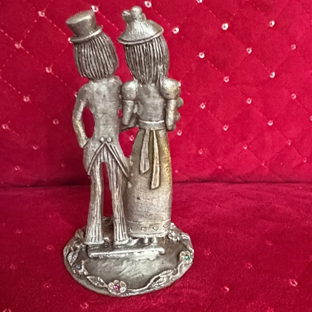 This is a vintage Italian Peltro pewter bride and groom figurine.